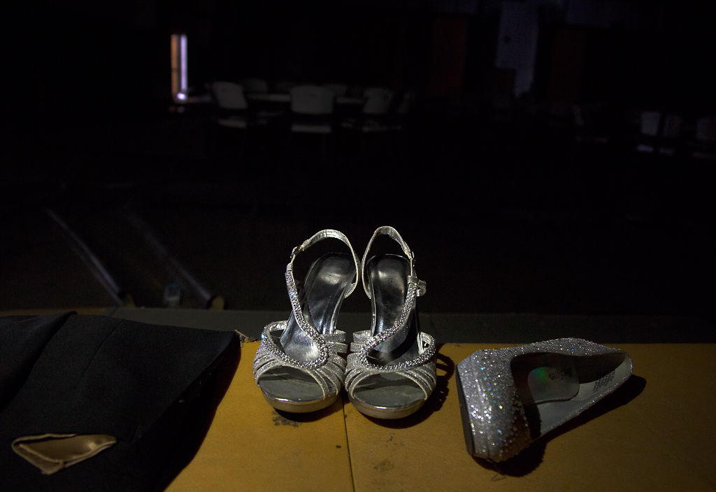 Forgotten heels sit on the bleachers